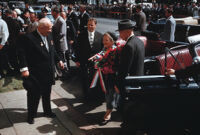 President Dwight Eisenhower and Premier of the Soviet Union Nikita Khrushchev watch Khrushchev's wife Nina Petrovna exit car during Khrushchev's September 1959 visit to Washington D.C