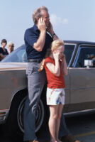 President Jimmy Carter and daughter Amy Carter watch First Lady Rosalynn Carter's flight depart for her South American tour