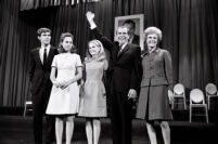 President Richard Nixon waves to crowd while accepting an award with First Lady Patricia Nixon, daughters Tricia and Julie, and unidentified man