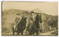 Bob Brown [?] and boy riding horses [photograph]