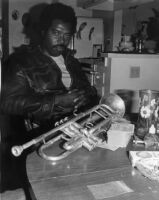 Harold Howard with trumpet, circa 1980 [descriptive]