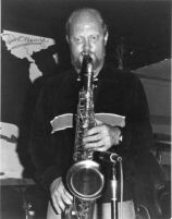 Autographed photo of Don Menza playing saxophone, 1979 [descriptive]