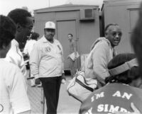 Andy Simpkins with Bill Cosby at the Playboy Jazz Festival in Los Angeles, 1983 [descriptive]