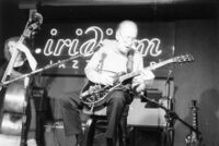 Les Paul and unidentified double bass player at the Iridium Jazz Club in New York City, circa 2002 [descriptive]