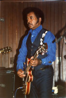 Jimmy Johnson playing guitar, 1987 [descriptive]