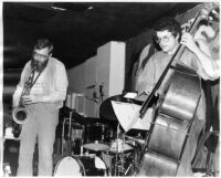 Charlie Haden and Lew Tabackin on stage, 1980 [descriptive]