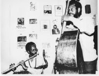 Jimmy and Percy Heath in The Barn, dressing room at the University of Redlands, 1980 [descriptive]
