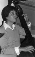Frank de la Rosa playing double bass in 1979 [descriptive] — Calisphere