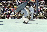 Tehuantepec, man carrying fake fish chased by nets, 1982 or 1985