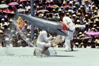 Tehuantepec, man carrying fake fish caught by net, 1982 or 1985