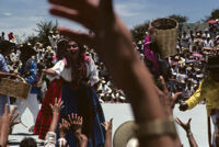 Ejutla de Crespo, performers throwing gifts to spectators, 1982