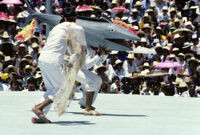 Tehuantepec, man carrying fake fish chased by nets, 1982 or 1985