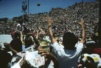 Flor de Pina, performers throwing gifts to spectators, 1982