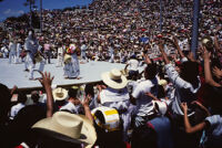 Macuiltianguis, performers throwing gifts to spectators, 1985