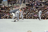 Tehuantepec, man carrying fake fish chased by net, 1982 or 1985