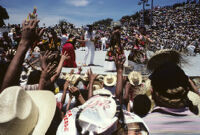 Tehuantepec, performers throwing gifts to spectators, 1982 or 1985