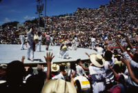 Macuiltianguis, performers throwing gifts to spectators, 1985