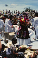 Tehuantepec, woman throwing flowers to spectators, 1985