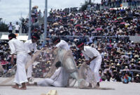 Tehuantepec, man carrying fake fish caught by net, 1982 or 1985