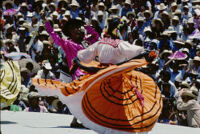 Ejutla de Crespo, dancers one couple orange skirt view from back, 1985
