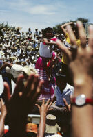 Chines de Oaxaca, performers throwing gifts to spectators, 1982