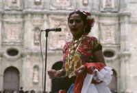 Awarding of prizes[?], woman singing, 1985