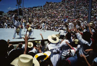 Macuiltianguis, performers throwing gifts to spectators, 1985