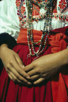 Ejutla de Crespo, close-up of woman's hands and beads at waist, 1982