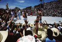 Macuiltianguis, performers throwing gifts to spectators, 1985