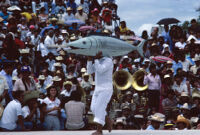 Tehuantepec, man carrying fake fish on shoulder, 1982 or 1985