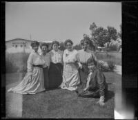 Mary A. West, Kate Schmitz, Alice Schmitz and three other women pose on the Velzy's front lawn, Los Angeles, about 1915