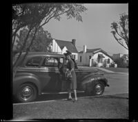 Mertie West getting out of a car in front of the house of William H. Shaw, Los Angeles, 1942