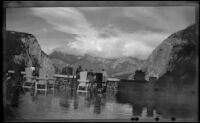 Hotel guests stand on a veranda overlooking the Bow River Valley, Banff, 1947