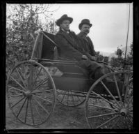 Bim Smith and Frank Baynham sitting in a buggy, Pomona, about 1895