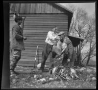 Dave F. Smith puts ducks on Waller Chanslor as Fred Gilmer watches, Gorman vicinity, circa 1910s