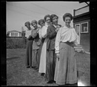 Alice Schmitz, Bessie Velzy, Mary A. West, Kate Schmitz and two other women pose in the Velzy's backyard, Los Angeles, about 1915