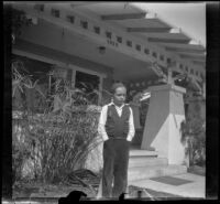 Richard D. West, stands in front of Wayne West's home, Santa Ana, 1933