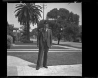 H. H. West stands in front of his house wearing his Shriners fez, Los Angeles, 1938