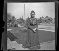 Louise Ambrose poses on her front lawn, Los Angeles, about 1894