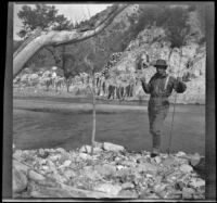 H. H. West posing with a string of fish, Los Padres National Forest vicinity, about 1917