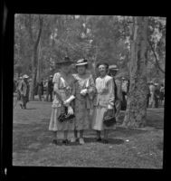 Nellie Hiatt poses with 2 unknown women in Lincoln Park while attending the Iowa State Picnic, Los Angeles, 1948