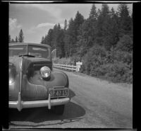 H. H. West's Buick passes over the Illinois River (east fork), Cave Junction vicinity, 1942