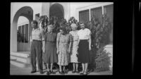 Rudy Newquist, Anna Newquist, Eva Newquist and 2 cousins stand outside the West residence, Los Angeles, 1948