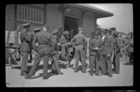 H. H. West Jr. stands with other soldiers at the Southern Pacific Railroad depot, San Luis Obispo, 1942