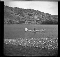 H. H. West and Dave F. Smith sit in a boat on Silver Lake, June Lake vicinity, 1913