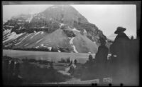 Mertie West looks out at a lake and mountain while en route to Moraine Lake, Lake Louise vicinity, 1947