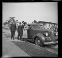 Wilson, Richard, Eleanor, and Mertie West stand by Wilson's Studebaker, Los Angeles, 1937