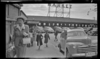 Mertie West walks towards Pike Place Market to shop for cherries, Seattle, 1947