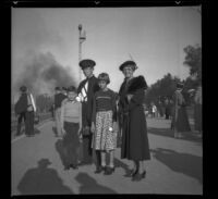 Richard Siemsen, H. H. West, Jr., Dottie Siemsen and Mertie West wait for a train, Glendale, 1937