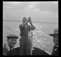 Charles Miles, Guy M. West and an unidentified man pose while fishing near Ocean Park, Santa Monica, about 1910